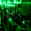 Laser spectroscopy to see the proton size. A complex laser system is needed to perform the muonic hydrogen experiment. The picture shows frequency doubling optics transforming infrared to green light.