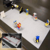 A LEGO optical setup. Beam-expander system -- He-Ne laser, beam stopper, polarizer, 2 mirrors, concave lens, convex lens, screen -- built using standard LEGO components. The mount system is more compact than older ones and all optical parts are on rotating stages in order to make the adjustment of the optical axis easier. This is a well-known Galileo type beam expander (4X magnification). Inset: path of the beam.