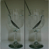 Negative refraction. The picture on the left shows how a spoon in a glass of water appears to break at the air-water interface, and then continues inside the liquid slightly shifted to one side, but still keeping the same orientation as in air -- left-to-right in this case. This optical illusion is due to the fact that the refractive index of water is different from the one of air -- still positive though, as in any other natural material. On the right, there is a basic illustration of what would happen by filling the glass with a liquid with a negative index of refraction: the orientation of the spoon inside the liquid would appear to be diametrically opposite to the spoon in the air, namely right-to-left instead of left-to-right.
