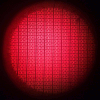 The unit of the Bokode. A Bokode is composed of a tiny optical lens which hides a series of miniaturized 2D barcodes. Surprisingly, a camera taking an out-of-focus picture is able to create a sharp image of the Bokode.